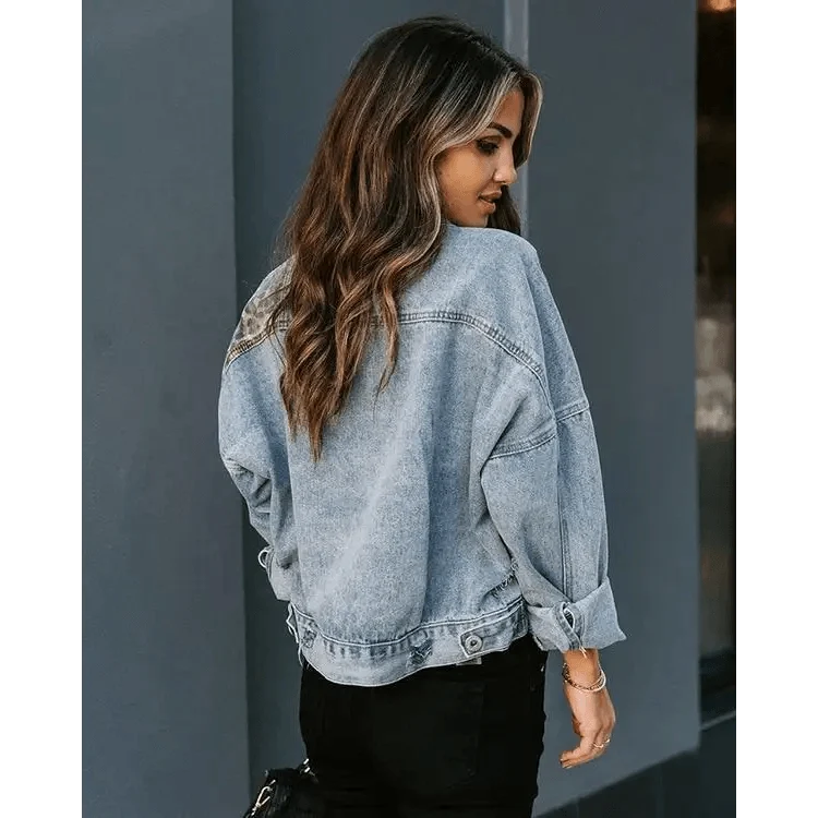 Light-wash denim trucker jacket by Stevvex, oversized fit with rolled sleeves, back view on Tampa Home & Garden Store