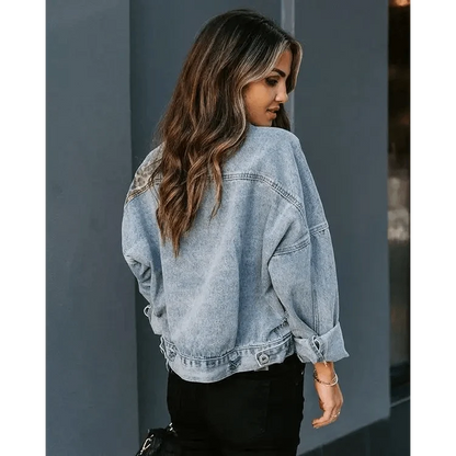 Light-wash denim trucker jacket by Stevvex, oversized fit with rolled sleeves, back view on Tampa Home & Garden Store
