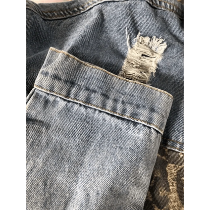 Denim trucker jacket Stevvex with distressed tear, light wash blue long sleeve on Tampa Home & Garden Store