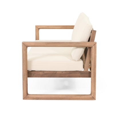 Outdoor acacia wood loveseat and coffee table set with white cushions on Tampa Home & Garden Store