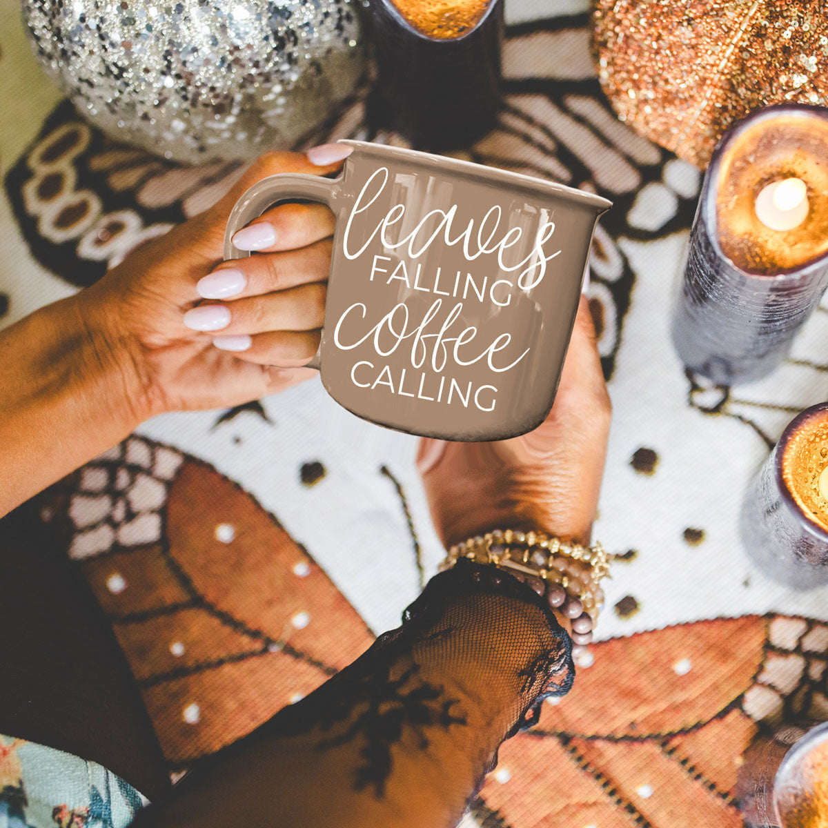 Leaves Falling mug by Gia Roma in taupe ceramic with white script Coffee Calling held by hands on Tampa Home & Garden Store