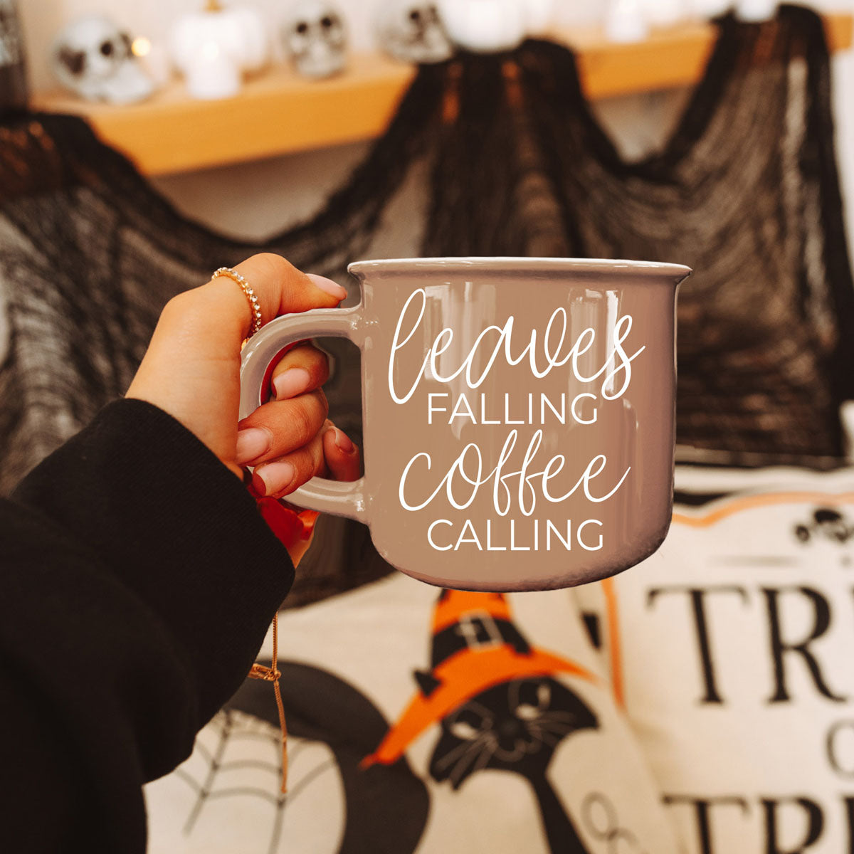 Gia Roma coffee mug Leaves Falling Coffee Calling in taupe ceramic held by a hand on Tampa Home & Garden Store