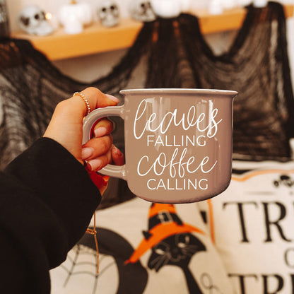 Gia Roma coffee mug Leaves Falling Coffee Calling in taupe ceramic held by a hand on Tampa Home & Garden Store