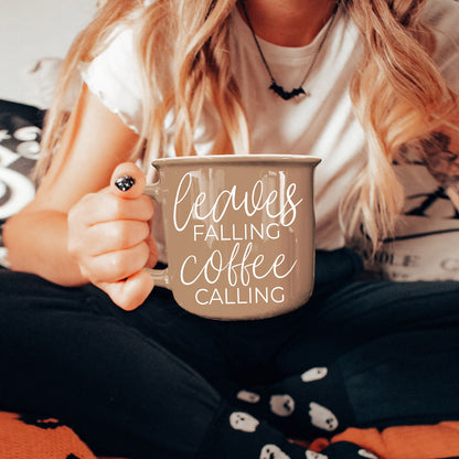 Leaves Falling coffee mug Gia Roma taupe ceramic with white script held in hand on Tampa Home & Garden Store