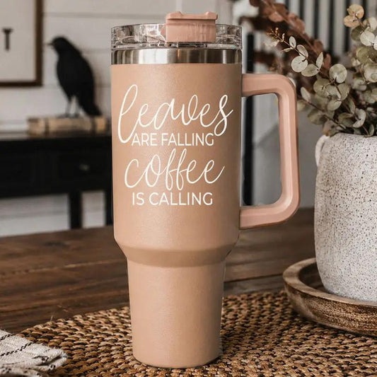 40oz blush beige travel mug with pink handle reading Leaves falling coffee is calling on Tampa Home & Garden Store