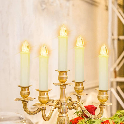 Flameless LED taper candles on a brass chandelier, five warm-white candles glow on Tampa Home & Garden Store