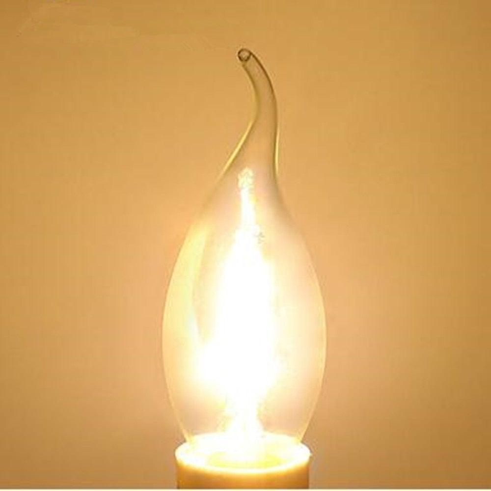Stevvex LED filament candle bulb, clear glass shell, flame-tip shape, warm 3000K soft white glow on Tampa Home & Garden Store