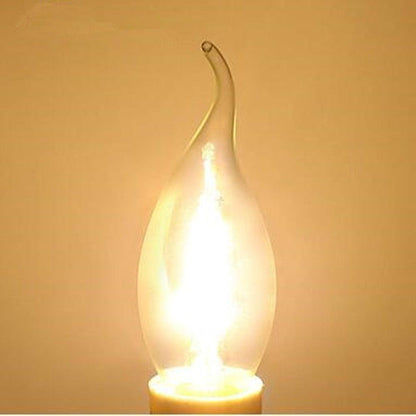 Stevvex LED filament candle bulb, clear glass shell, flame-tip shape, warm 3000K soft white glow on Tampa Home & Garden Store