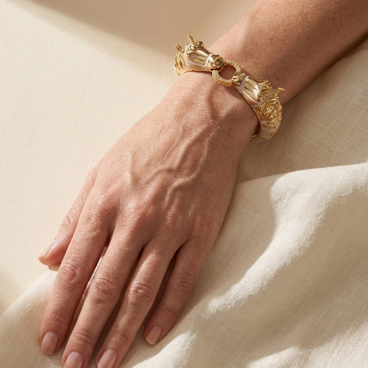 Lauren G Adams gold-tone Equestrian Horse Bangle with pave circle links bracelet on wrist on Tampa Home & Garden Store