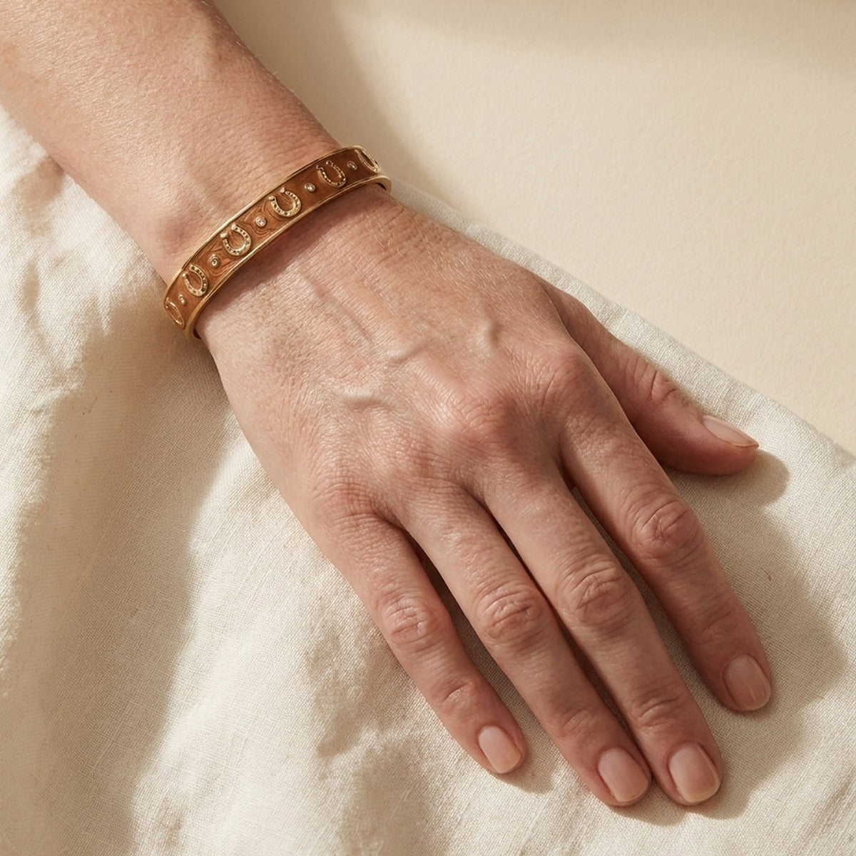 Equestrian Horseshoe Bangle Lauren G Adams flat gold-tone slip-on bracelet with horseshoe motifs on Tampa Home & Garden Store