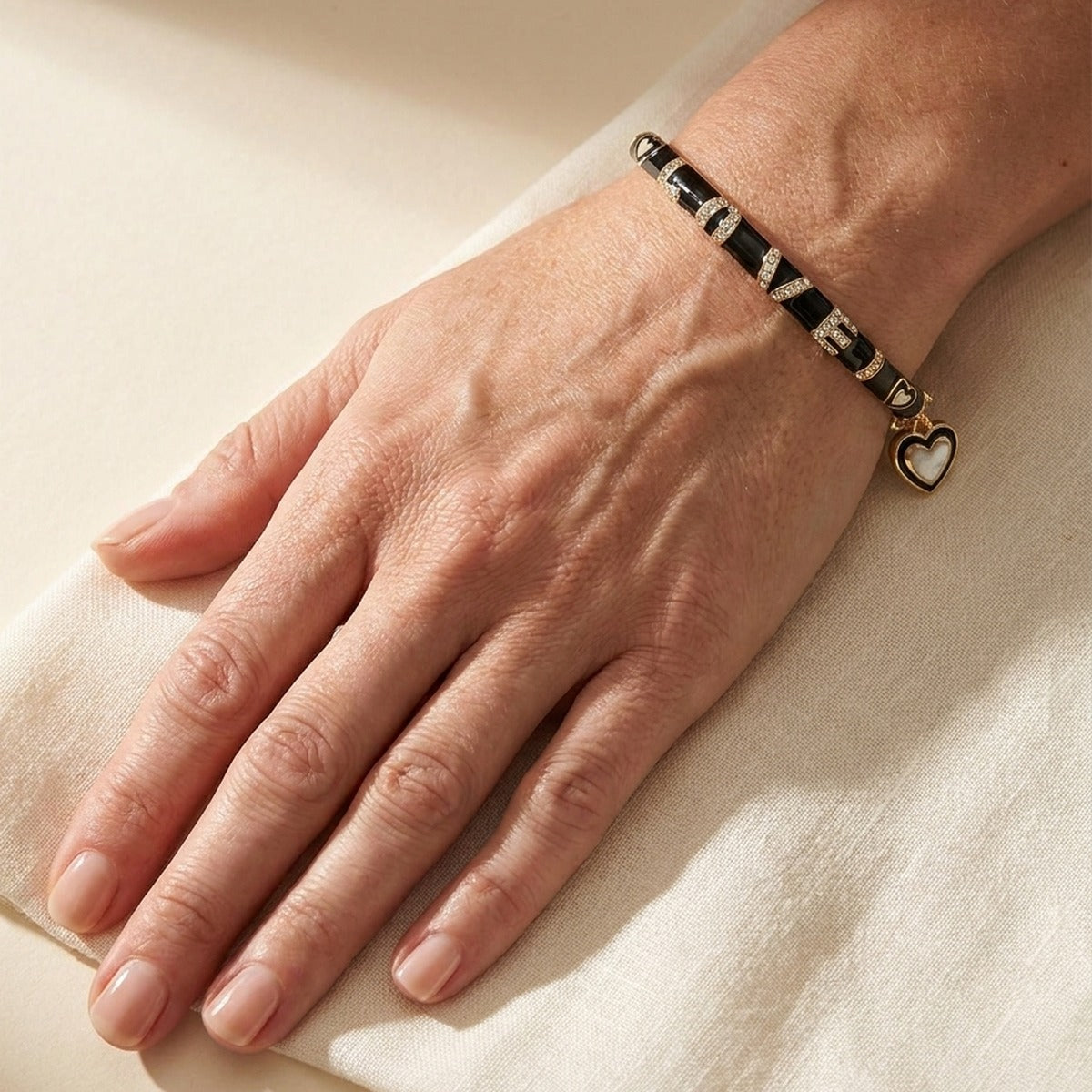 Charming 2 Love Bangle stackable bracelet by Lauren G Adams with black enamel segments, rhinestone accents, and a heart charm on Tampa Home & Garden Store