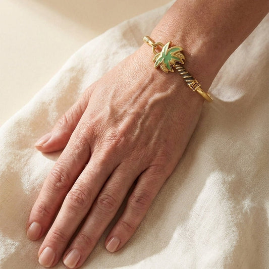 Eau Palm Tree Bangle with bold hook clasp, gold-tone bracelet featuring a green palm charm on Tampa Home & Garden Store