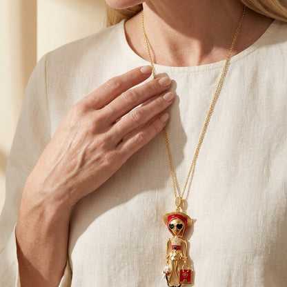 Uptown Girls Pendant Necklace gold-tone chain with whimsical girl charm and red accents on Tampa Home & Garden Store