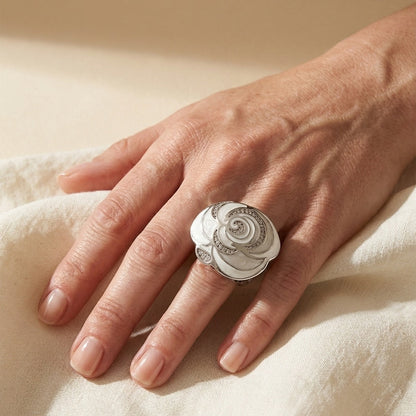 Roses Are Red cocktail ring with a large white rose motif and pavé detailing on finger on Tampa Home & Garden Store