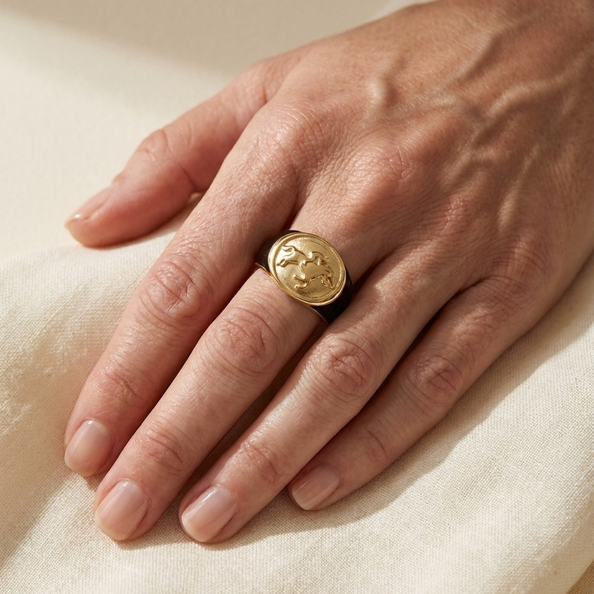Band ring with gold oval jockey medallion on a black band by Lauren G Adams on Tampa Home & Garden Store