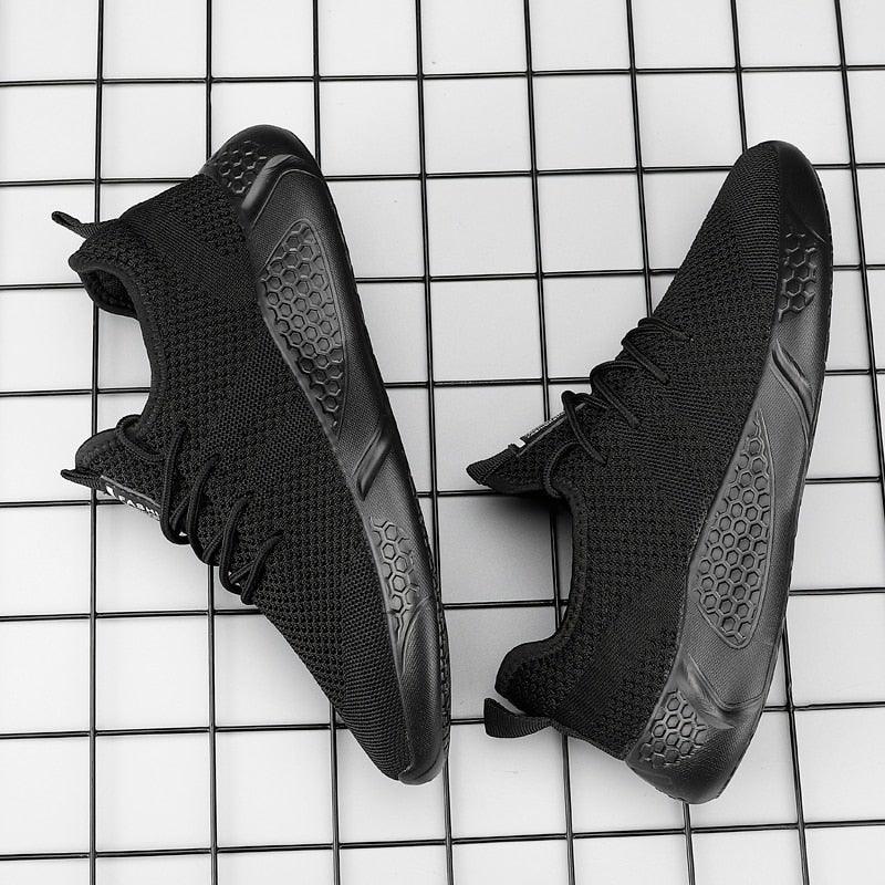 Stevvex men's black mesh sneakers pair with breathable knit upper and honeycomb outsole on Tampa Home & Garden Store