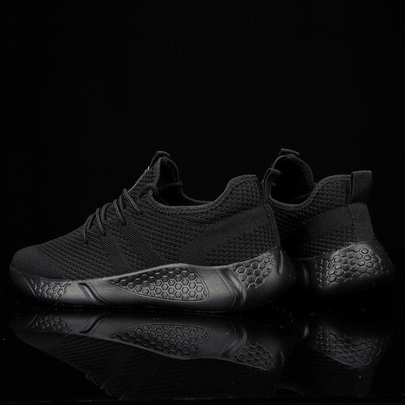 Men's Stevvex mesh running sneakers, black breathable upper with hexagonal non-slip sole on Tampa Home & Garden Store