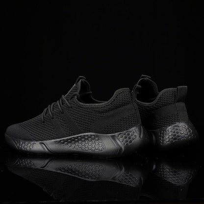 Men's Stevvex mesh running sneakers, black breathable upper with hexagonal non-slip sole on Tampa Home & Garden Store