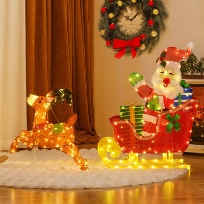 Christmas decor display with illuminated reindeer, Santa sleigh, wreath, and gifts on a snowy rug on Tampa Home & Garden Store