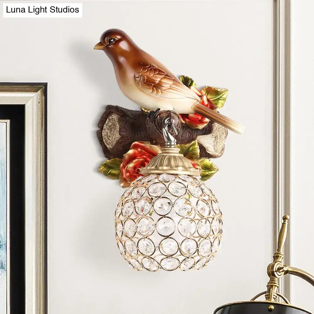 Brown Bird Wall Sconce by Decorbites with crystal globe shade and brass cap on a branch on Tampa Home & Garden Store