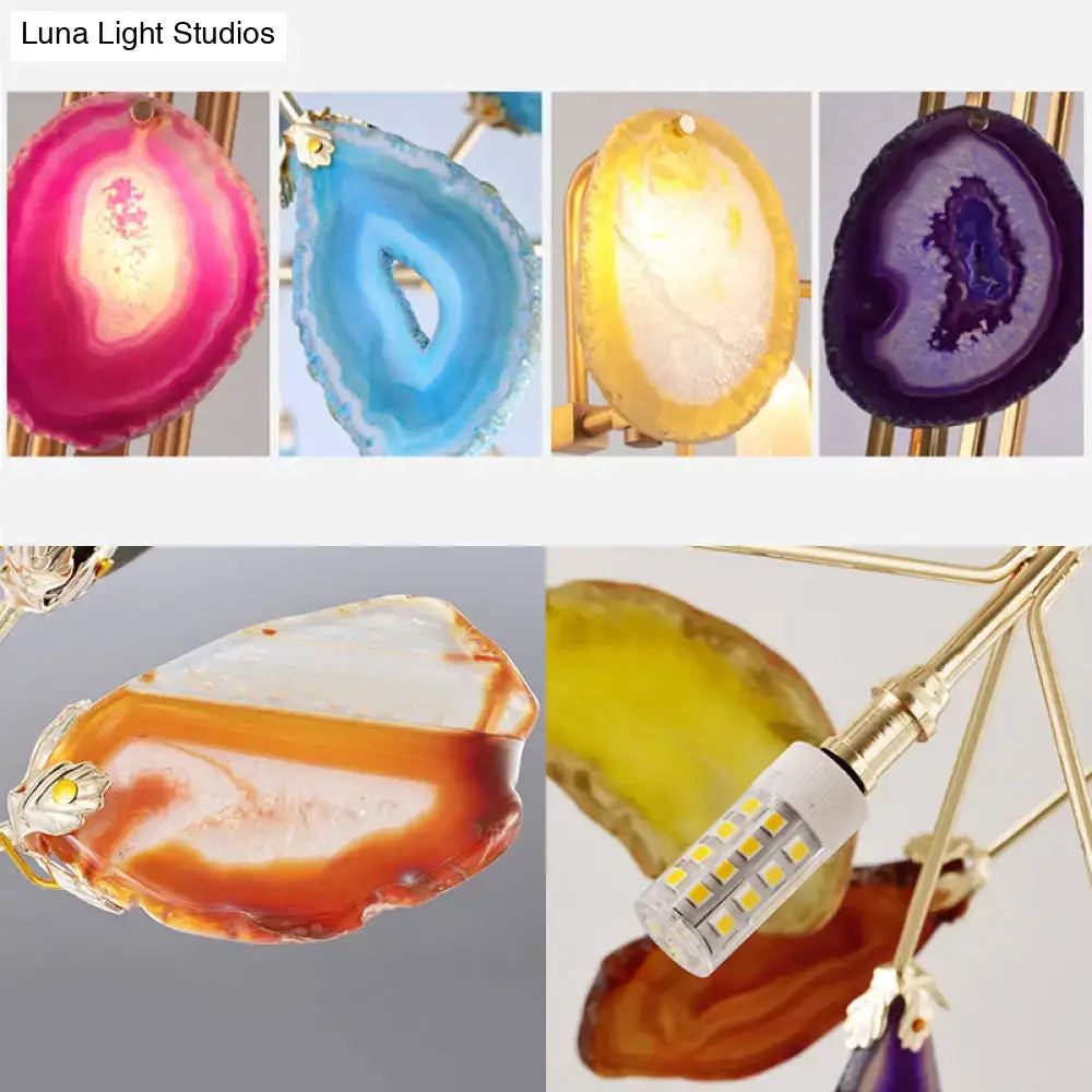Gold branch wall sconce with two lights and four crystal geode slices in pink blue yellow purple on Tampa Home & Garden Store