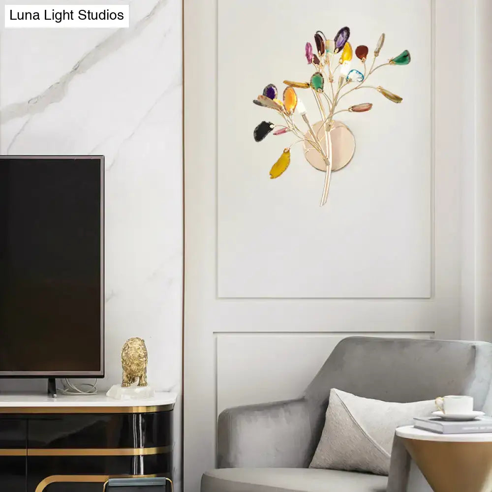 Decorbites Gold Branch Wall Sconce Two-Light Colored Crystal with gold branch design in a modern living room on Tampa Home & Garden Store