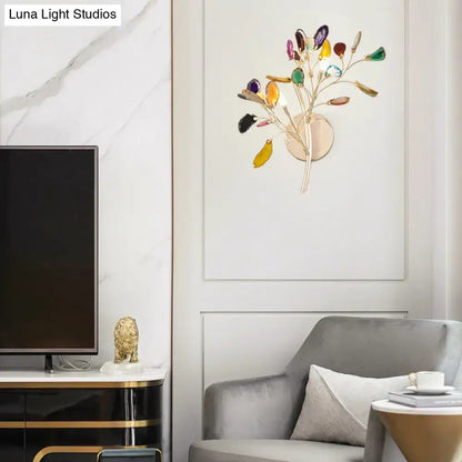 Decorbites Gold Branch Wall Sconce Two-Light Colored Crystal with gold branch design in a modern living room on Tampa Home & Garden Store