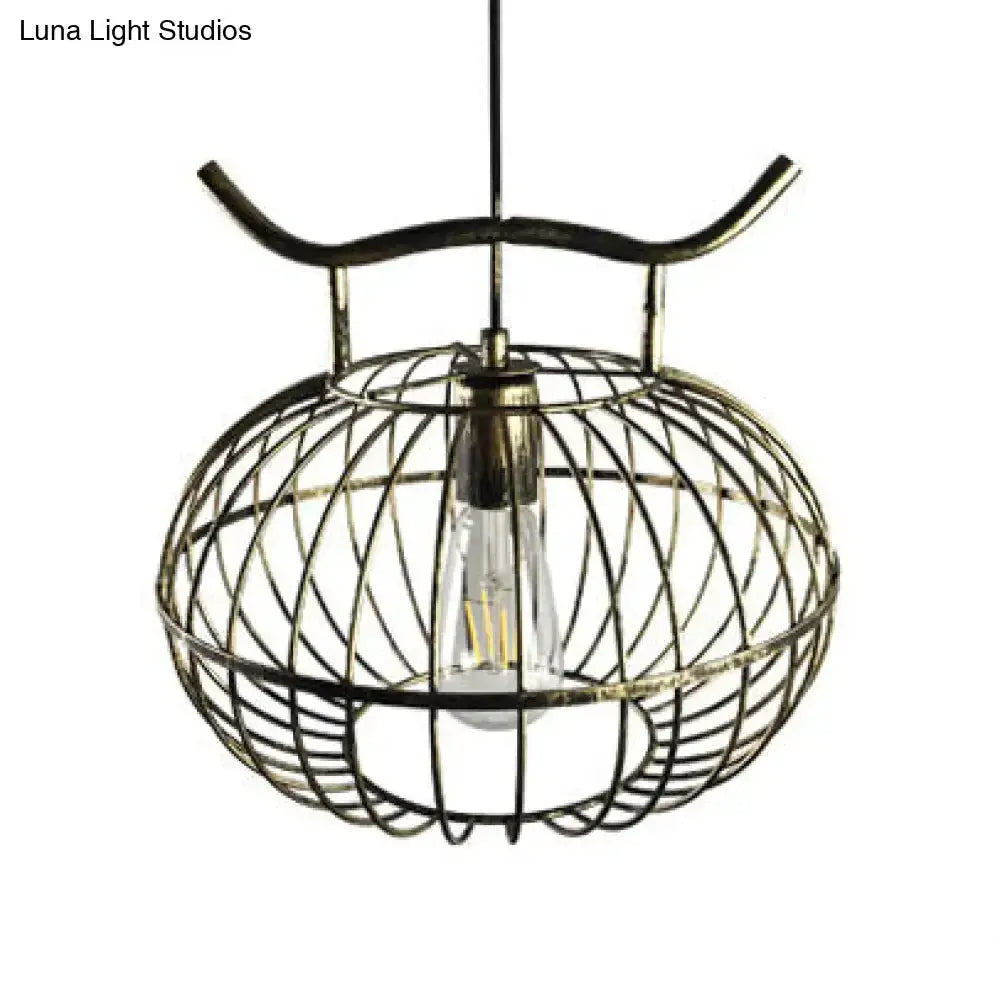 Lodge rust & aged brass lantern pendant light by Decorbites with a wire cage frame on Tampa Home & Garden Store
