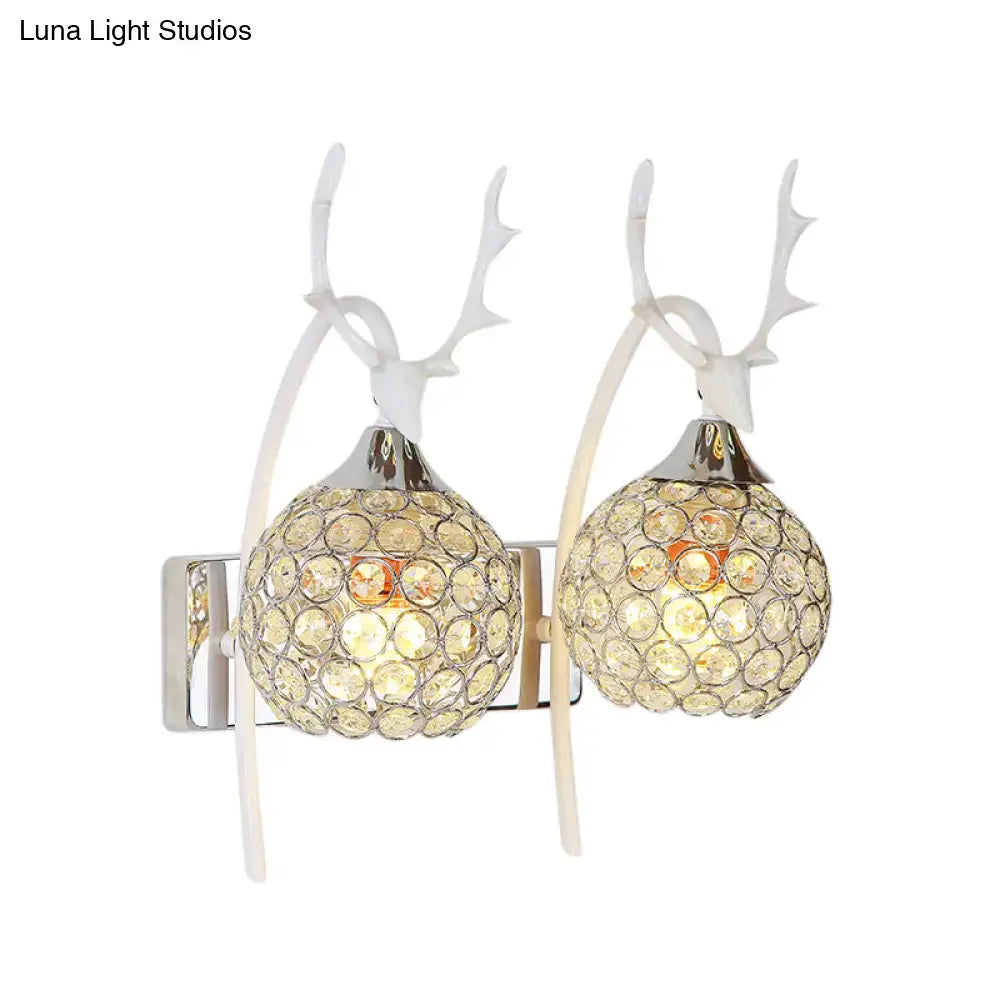 Chrome deer wall sconce by Decorbites with crystal dome, dual antler arms, 1-2 light on Tampa Home & Garden Store