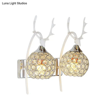 Chrome deer wall sconce by Decorbites with crystal dome, dual antler arms, 1-2 light on Tampa Home & Garden Store