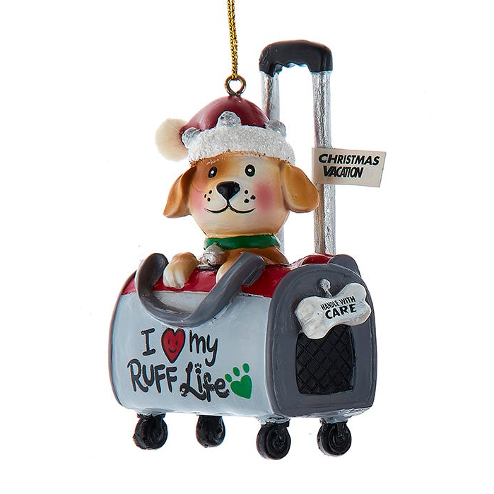 Adorno de perro en una bolsa de viaje -