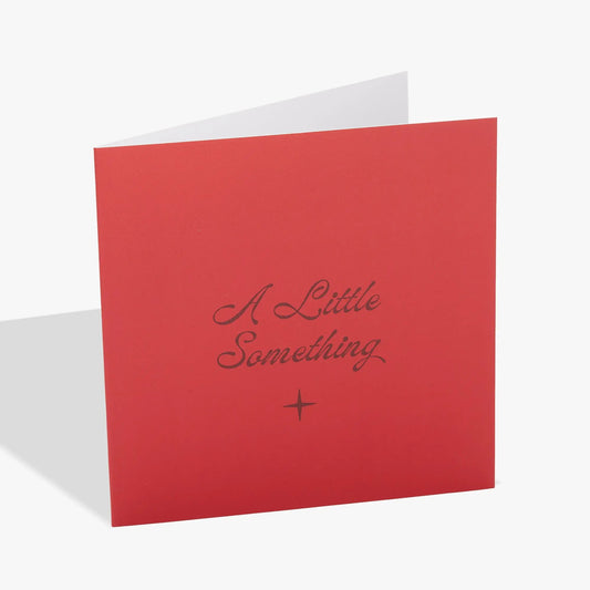 Love Greeting Card red card with cursive A Little Something and small star accent on Tampa Home & Garden Store