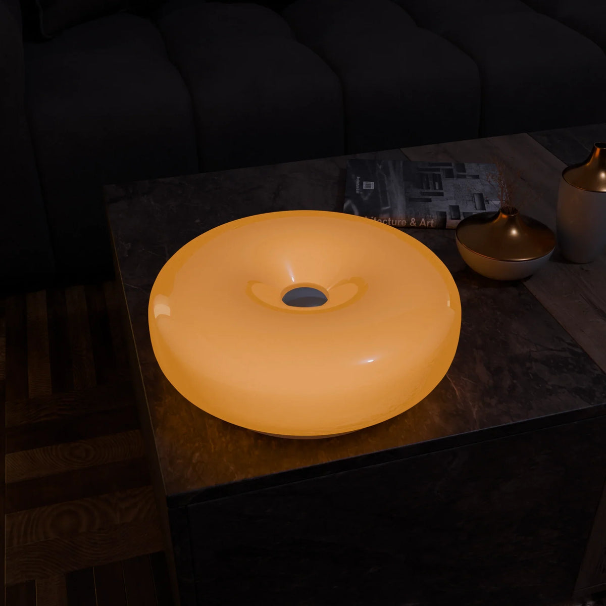 Lumo Donut Glass LED table lamp yellow donut-shaped glass shade on marble coffee table on Tampa Home & Garden Store