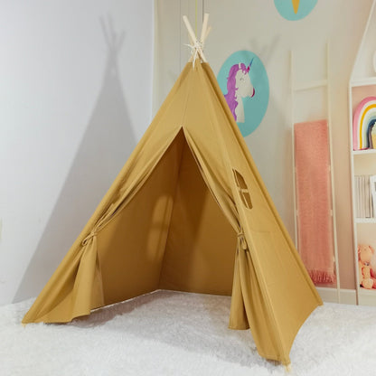 Kids cotton teepee play tent in tan with wooden poles set on white shag rug in a pastel playroom on Tampa Home & Garden Store