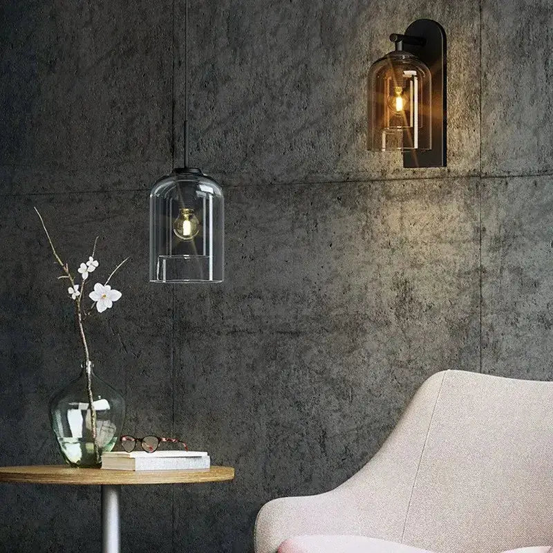 Two glass pendant wall sconces, amber and clear glass with black hardware Decorbites on Tampa Home & Garden Store