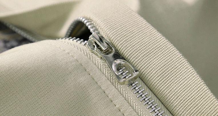 Stevvex men's jacket zipper close-up on beige fabric on Tampa Home & Garden Store