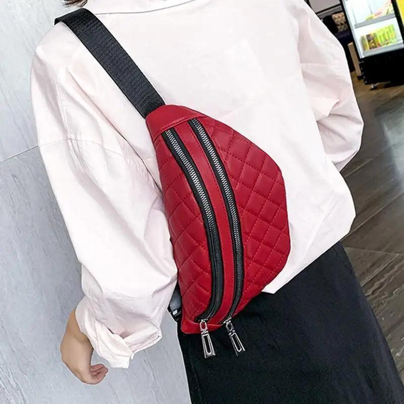 Red quilted PU leather fanny pack with dual zippers and a black adjustable strap worn crossbody on Tampa Home & Garden Store