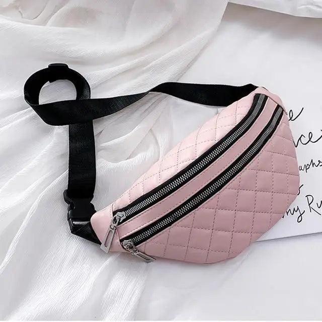 Pink quilted waist bag with dual zippers and a black adjustable strap on Tampa Home & Garden Store
