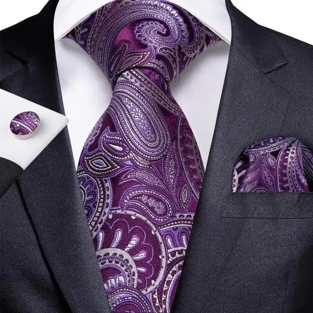 Silk men's necktie with purple paisley design and matching pocket square on a dark suit on Tampa Home & Garden Store