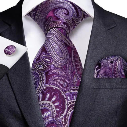 Silk men's necktie with purple paisley design and matching pocket square on a dark suit on Tampa Home & Garden Store