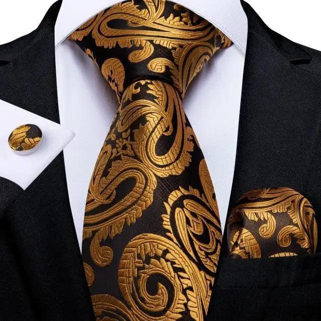 Stevvex three-piece paisley gold-on-black silk tie with pocket square and cufflinks on black suit on Tampa Home & Garden Store