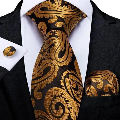 Stevvex three-piece paisley gold-on-black silk tie with pocket square and cufflinks on black suit on Tampa Home & Garden Store