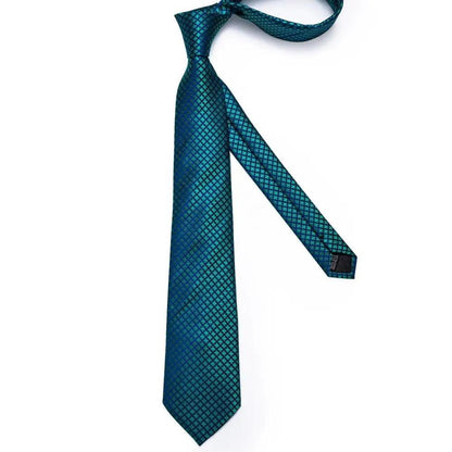 Stevvex blue silk necktie for men with teal geometric diamond pattern on Tampa Home & Garden Store