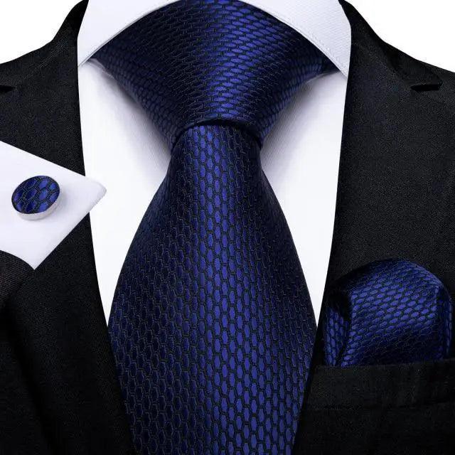 Luxury blue silk tie with textured pattern and matching pocket square on a black suit by Stevvex on Tampa Home & Garden Store