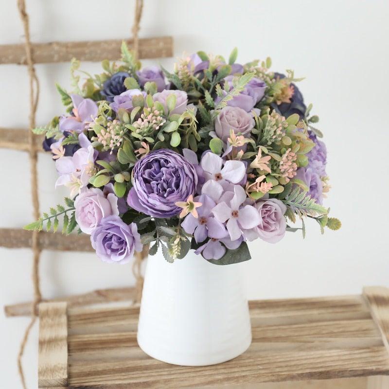 Stevvex artificial silk rose bouquet in white vase with lavender and purple blooms on Tampa Home & Garden Store