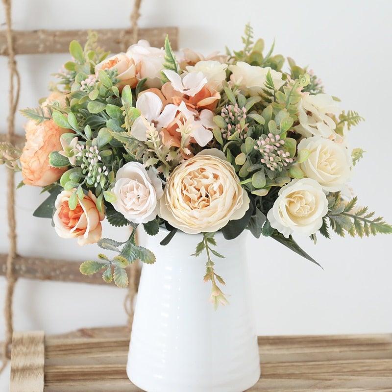 Stevvex artificial silk rose bouquet in white vase with peach and ivory roses and greenery on Tampa Home & Garden Store