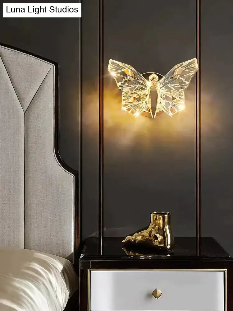 Gold Butterfly Nordic LED Wall Lamp by Decorbites, crystal butterfly emits warm glow on dark wall on Tampa Home & Garden Store
