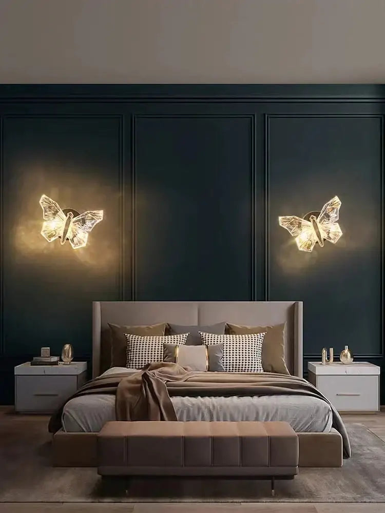 Decorbites gold butterfly Nordic LED wall lamp pair glowing over navy paneled bedroom wall on Tampa Home & Garden Store