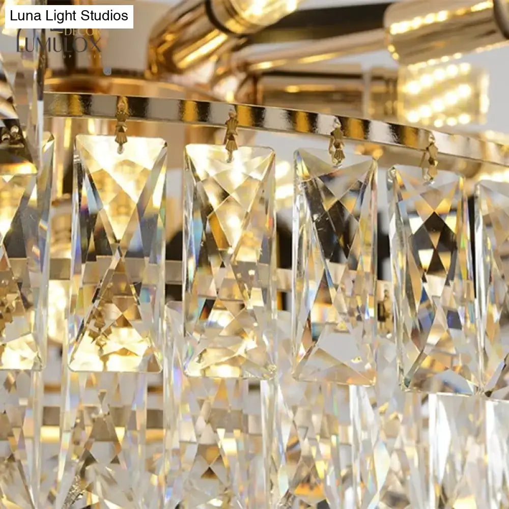 Black Crystal Tiered Chandelier by Decorbites with a gold-tone frame and hanging clear prisms on Tampa Home & Garden Store