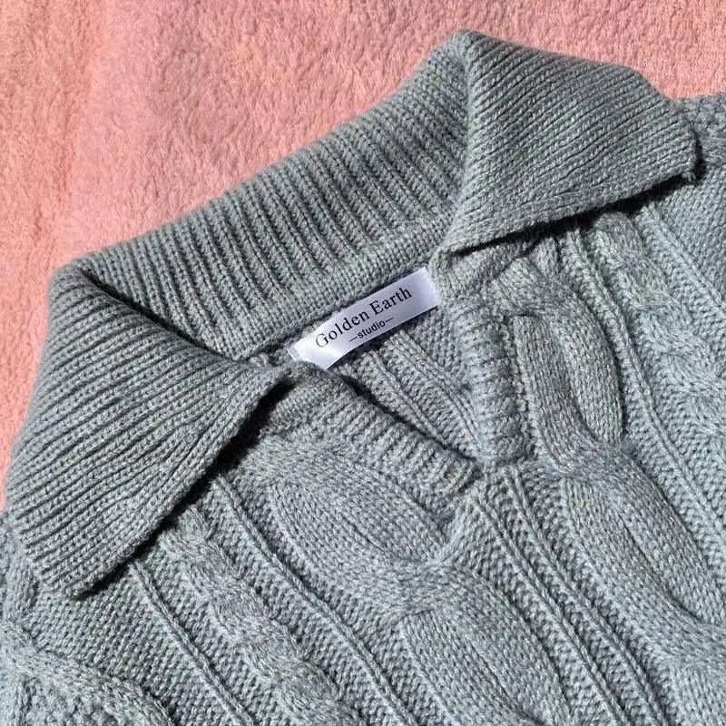 Stevvex grey cable-knit sweater with turn-down collar, loose fit; Golden Earth tag visible on Tampa Home & Garden Store